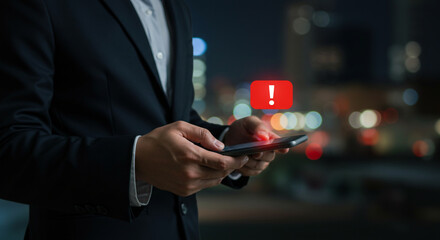 Man in suit receiving urgent notification on a mobile phone screen.