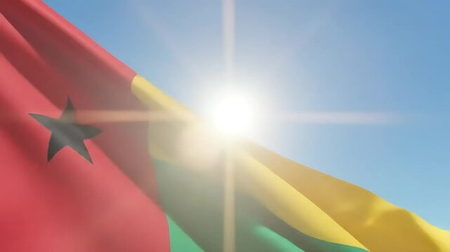 Guinea-Bissau flag waving proudly in the wind under a clear blue sky, symbolizing national pride