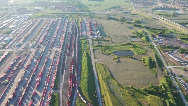 Aerial view of a vast railroad yard with trains and tracks