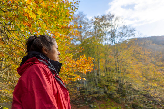 Woman hiking in Gorbea Park during autumn