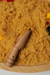 Delicious traditional dessert prepared with sweet ingredients and served in a wooden bowl during a...