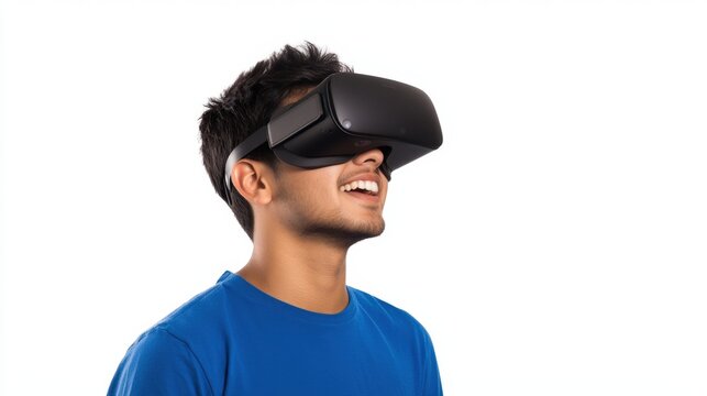 Young man enjoying virtual reality experience with VR headset while smiling and looking upward in bright and modern setting, technology concept.