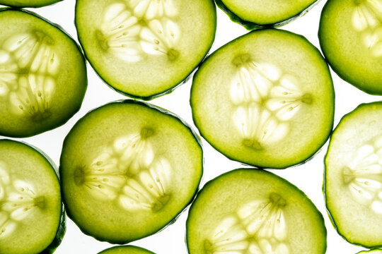 Fresh cucumber slices arranged in vibrant pattern - Powered by Adobe