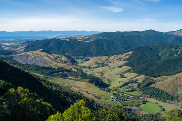 Panoramic View of Lush Green Valleys and Distant Mountains
