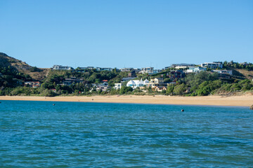 Scenic Beach View with Hillside Houses