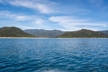 Serene Coastal Landscape with Calm Sea and Lush Hills