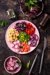 Balanced healthy bowl with vegetables and salmon