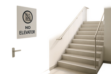 Stairwell view with no elevator warning sign on wall above handle, beige interior design