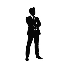 Silhouette of a businessman standing with arms crossed