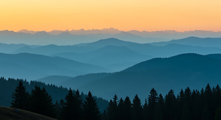 Layered mountain ranges at sunrise with evergreen forest foreground mountains orange