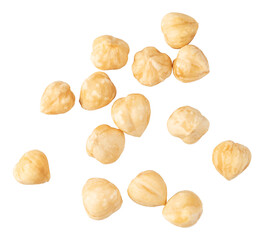 Peeled hazelnuts falling on transparent background