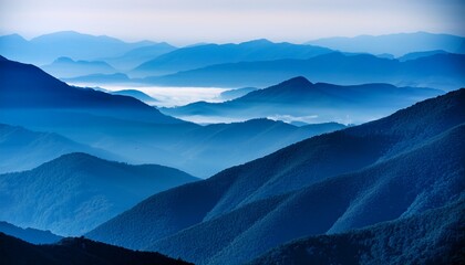 misty mountains at dusk layers of blue hues