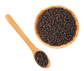 Black peppercorns in wooden bowl and spoon on transparent background