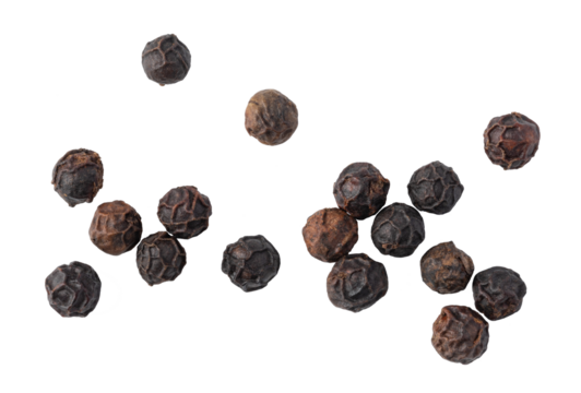 Black peppercorns falling on transparent background