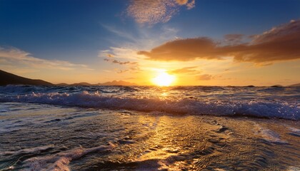 glistening ocean waves create a mesmerizing spectacle as they reflect the golden hues of a breathtaking sunset evoking emotions of peace and introspection in every viewer