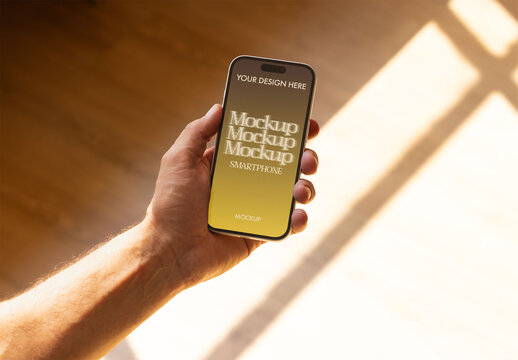 Mockup of man Holding a Smartphone