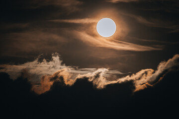 moon over the clouds like waves