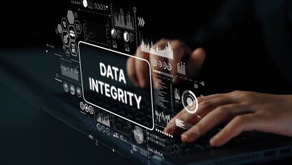Hands Typing on Laptop with Overlay Text Data Integrity and Digital Graphs Representing Technology and Business Analysis. Asymptotic smart data analytic.