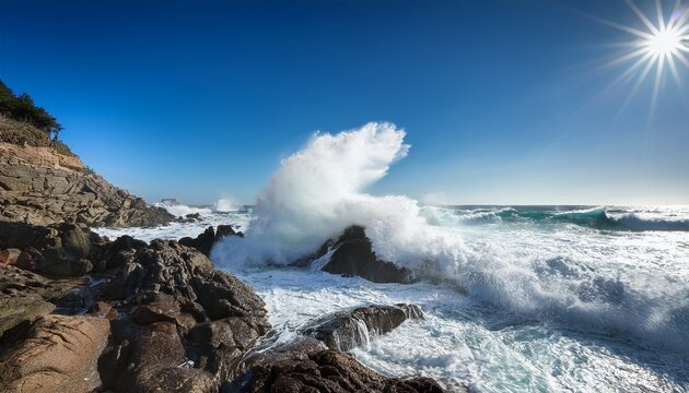 dynamic ocean wave crashing on rocky shoreline under clear blue sky