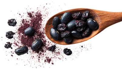 Wooden spoon holds black beans over a bed of deep purple powder