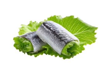 Two fish rolls, wrapped in a light coating, resting on fresh lettuce leaves