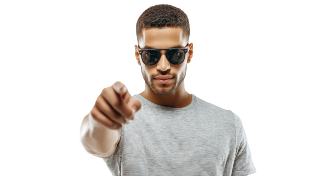 Confident man in sunglasses pointing forward, wearing a gray t-shirt, white isolated background.
