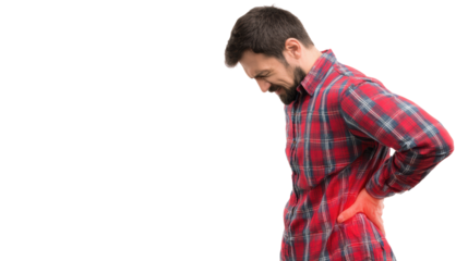 Man in plaid shirt experiencing back pain standing in a neutral pose.