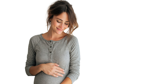 Pregnant woman smiling gently, wearing a grey shirt, holding her belly, isolated on white background.