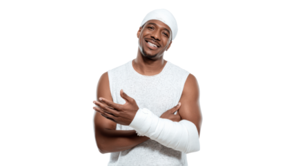 Smiling man with a bandaged arm in athletic wear, expressing positivity and resilience.