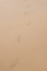 footprints on the sandy beach