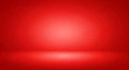 Vibrant red studio backdrop with soft spotlight creating a dramatic, empty stage perfect for product showcases and impactful presentations.
