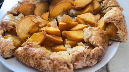 Slice of homemade peach pie on a plate — summer dessert for culinary recipes, blogs, and dessert packaging