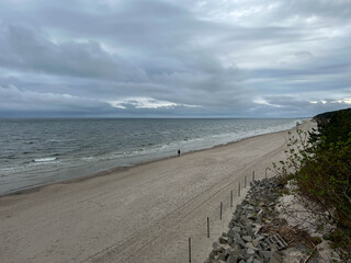 Empty Baltic beach in May with cloudy, calm weather, Mrzezyno region in Poland, as a background