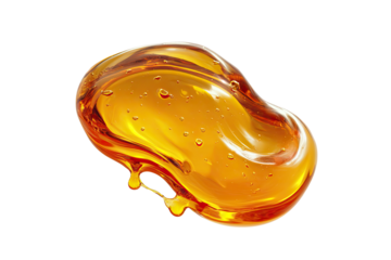 A glistening, amber-hued blob of liquid, dripping