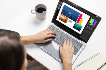 Graphic designer software for modern design of web page and commercial brisk ads showing on the computer screen