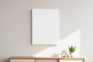 A blank white canvas hangs on a lightcolored wall above a wooden surface