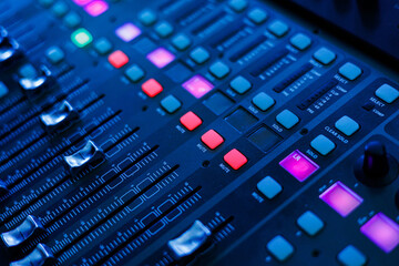 Concert sound mixer panel with volume regulators. Professional audio and light equipment for sound recording studio, live music broadcasting, television, party. mixing console. audio signals