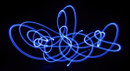 Abstract light painting, swirling blue lines on black background