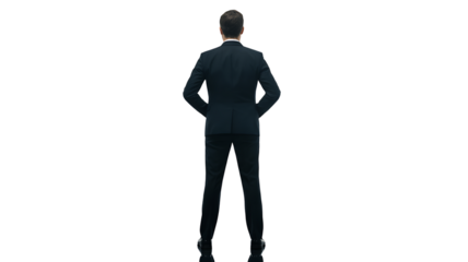A professional businessman wearing a dark suit and tie stands with his back to the viewer isolated on transparent background