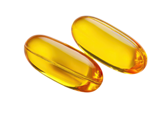 Two golden yellow, oblong capsules, transparent and slightly overlapping, set against a pure black background