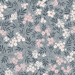 Vector seamless floral pattern. Gentle pattern in small flowers. Small pink and beige pastel flowers. Gray background. Ditsy floral background. Vintage template for fashion prints. Stock vector flower