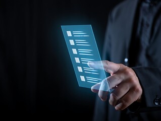 Businessman using a futuristic transparent smartphone displaying a digital checklist or to do list with glowing blue interface