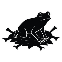 Black silhouette of a frog sitting on a pile of leaves