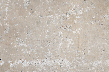 Rough concrete surface with white mineral deposits
