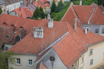 Obraz premium Aerial view of historic rooftops with red tiles 