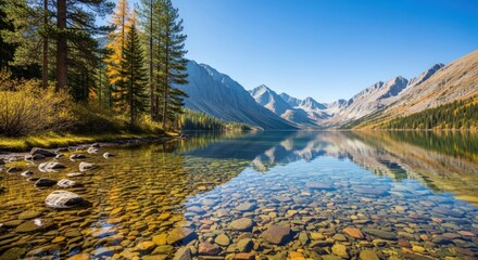 Fototapeta premium Crystal clear mountain lake reflecting the sky and surrounding pine forest in autumn