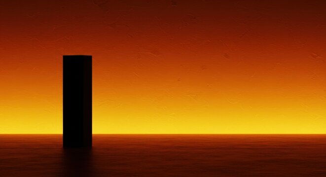 A solitary black monolith stands against a vibrant orange and yellow sunset sky