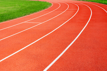 Turn of the rubber treadmill in empty stadium in the summer.