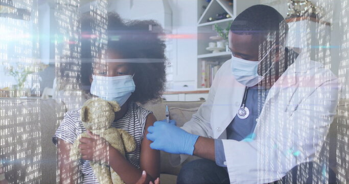 Child receiving vaccine injection from doctor on sofa in living room, with teddy bear and syringe