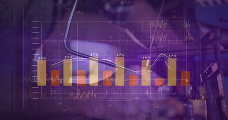Clasping hands of business partners at office desk, with smartphone and financial chart overlays